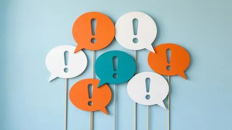 Group of scattered speech bubbles with exclamation marks representing commu.. Stock Illustration