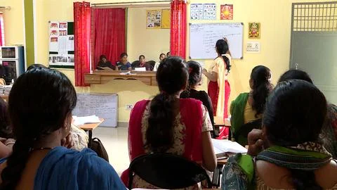 A group of school children studing in a class in a local village school Stock Photos