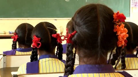 A group of school children studing in a class in a local village school Foto stock