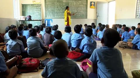 A group of school children studing in a class in a local village school Foto stock