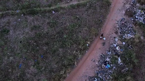 Group of school kids biking through the wasteland Stock Footage 80837598