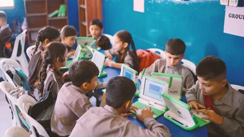 Group of schoolchildren use small laptops in a Karachi classroom, Pakistan Stock Footage 329222054