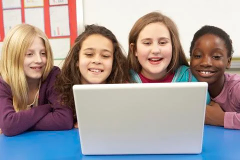 Group Of Schoolgirls In IT Class Using Computer Stock Photos