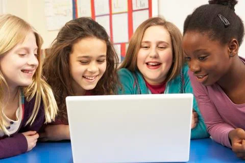 Group Of Schoolgirls In IT Class Using Computer 스톡 사진