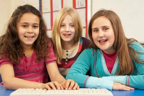 Group Of Schoolgirls In IT Class Using Computer 스톡 사진