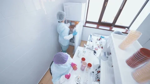 Group of scientists doing analyzes and tests in a modern bacteriological Stock-Footage 189305874