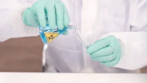 Group of Scientists with a microscope in laboratory, developing a vaccine Stock Footage 133074939