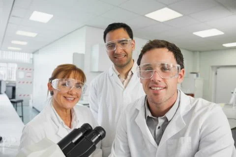 Group of scientists posing in laboratory Fotos Stock