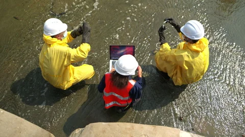 Group of scientists in protective suits are collecting water samples 動画素材 340077877