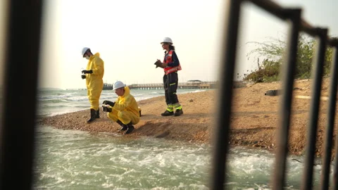 Group of scientists in protective suits are collecting water samples Stock-Footage 340084390