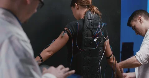 Group of scientists working on exoskeleton Stock Footage 97672428