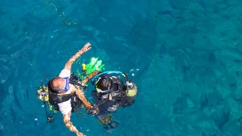 Group Of Scuba Divers Getting Back Onto Diving Boat Vídeo Stock 96668611