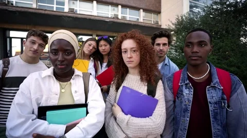 Group of serious and confident young multiracial students standing with folders Stock Footage 268236899