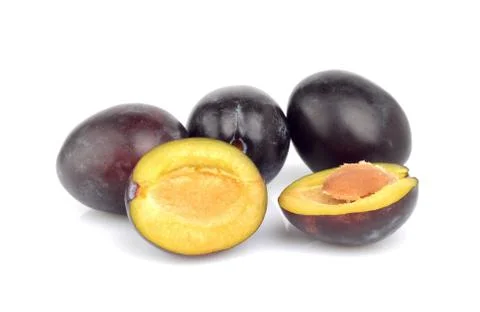 Group of shiny ripe plums isolated on white Stock Photos