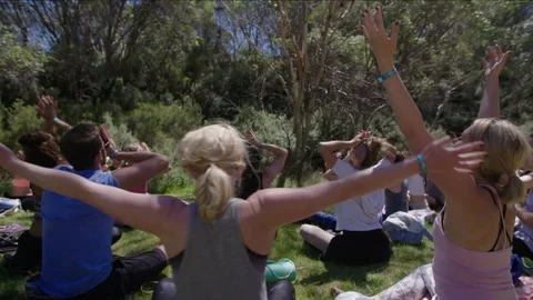 Group sitting doing yoga Video stock 73489587