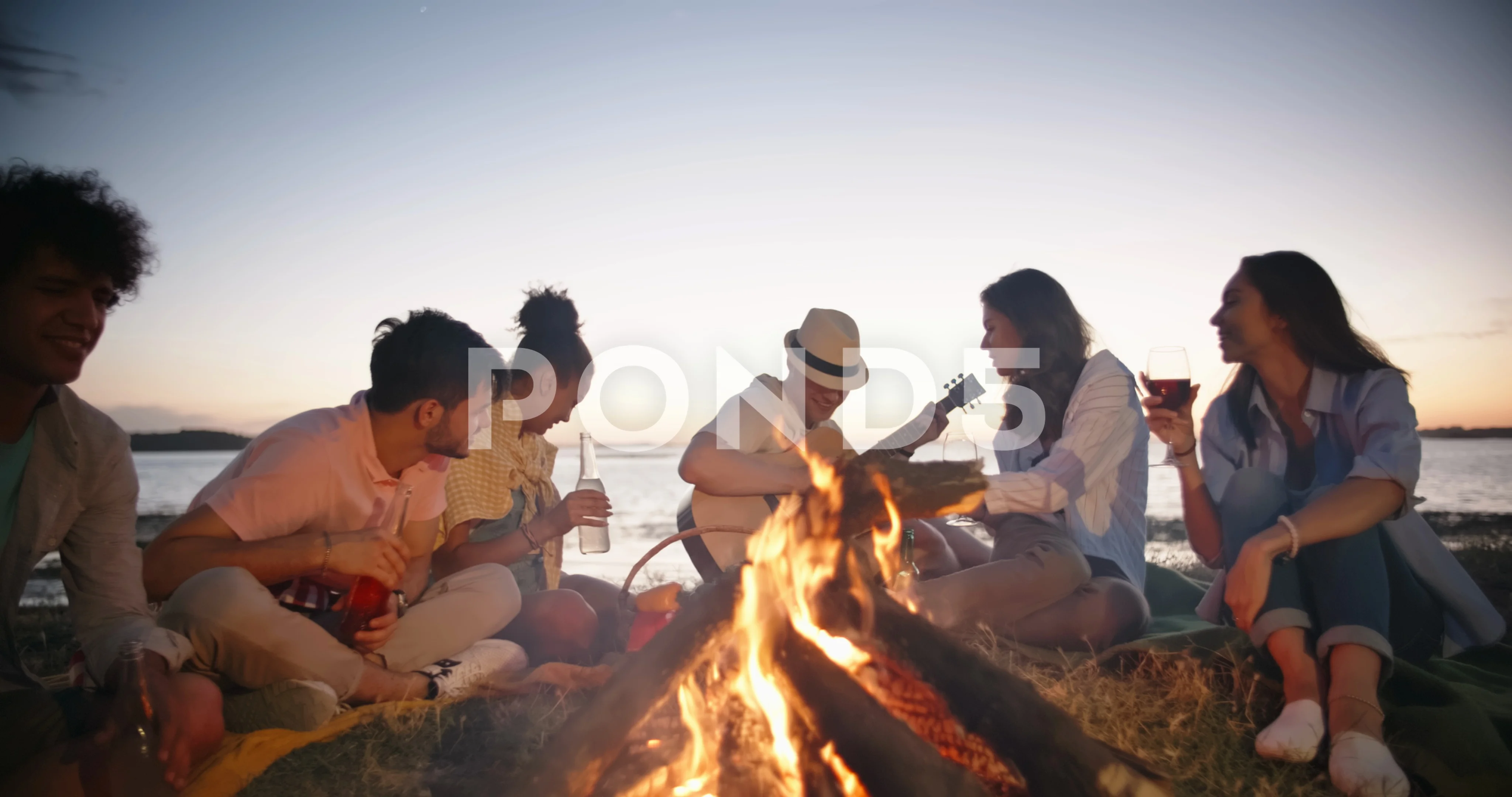 Summer Friends Around a Beach Campfire