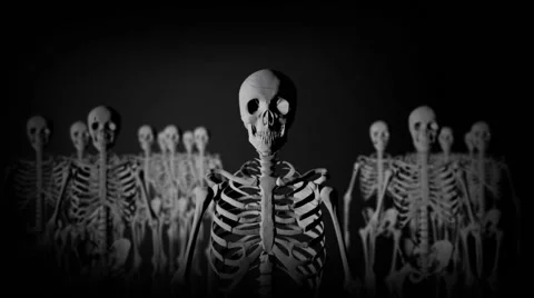 Group of Skeletons Standing in the Dark staring at the Camera in a Creepy Look Stock Footage