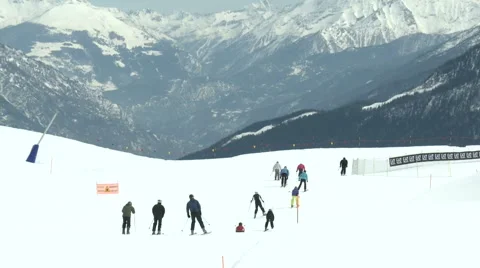 Group of skiers going down a mountain  Stock Footage 43324748