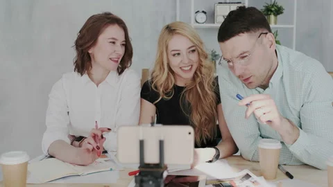 A group of a skilled design experts are recording a video course about new Stock Footage 106194950