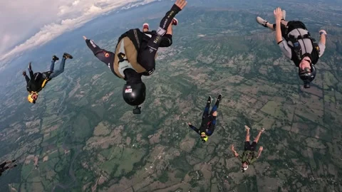 A Group of sky divers at maximun speed in free fall Stock Footage 259028015