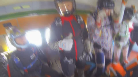 A group of skydivers in airplane NTSC Stock Footage 30296386