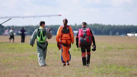 A group of skydivers go to the plane for a parachute jump. Kirzhach Russia July Stock Footage 250014802