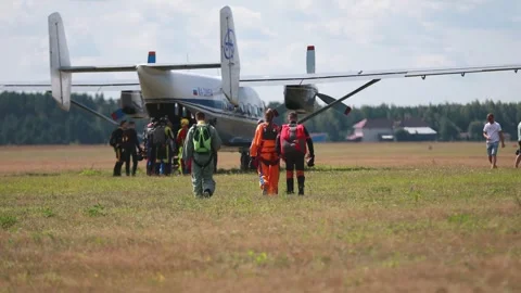 A group of skydivers go to the plane for a parachute jump. Kirzhach Russia July Stock Footage 250014832