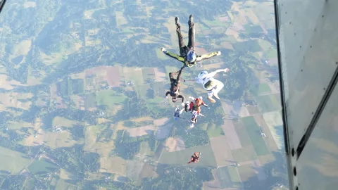Group of Skydivers Jump From a Small Plane Stock Footage 208737826