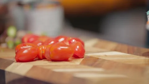 Group of Sliced and Whole Cherry Tomatoes on Geometric Board Stock Footage 327308609