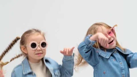 A group of small children dancing on a white background Stockbeeldmateriaal 264044802