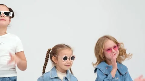 A group of small children dancing on a white background Stockbeeldmateriaal 264045441