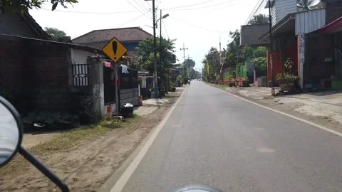 A group of small children running on the side of the road Stock Footage 199760347