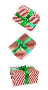 A group of small, colorful gift boxes wrapped in festive paper with ribbons.. Foto stock