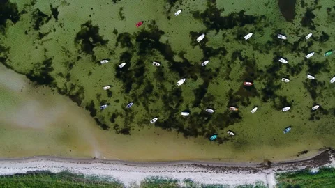 Group of small dinghy lying in the water aerial 4K Video stock 236723570