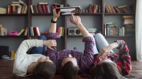 Group of smiling friends with tablet Stock Footage 59337907