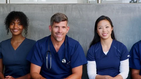 Group of smiling healthcare professionals, male and female Stock Footage