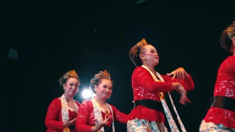 Group of Smiling Javanese Dancers Performing Synchronized Routine on Stage Stock Footage 263949442