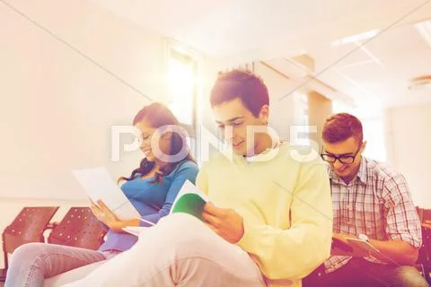 Group of smiling students in lecture hall Stock Photos