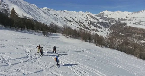 A group of snowboarders on the freeride Stock Footage 82971008