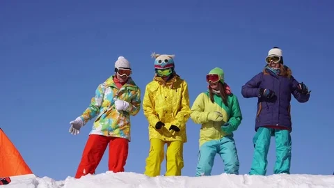 Group of snowboarders having fun Stock Footage 73564128