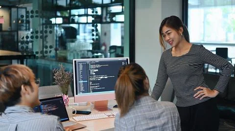 Group of software development working on web site project and creating Stock Photos