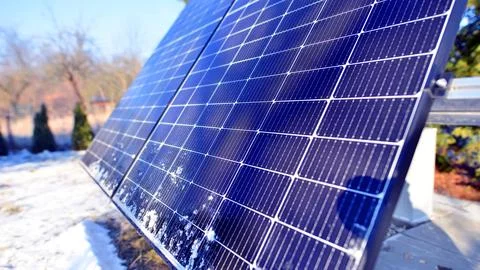 Group of solar panels in winter time. Stock Photos