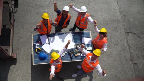 Group of Solar power plant Engineers Team Meeting raised hands up together on Stock Footage 159393680