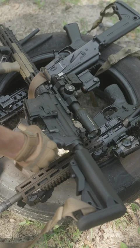 Group of soldiers disassembling rifles for cleaning and maintenance Stock Footage 333612728