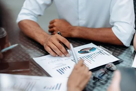 Group of specialists analyzing financial data. close-up. Stock Photos
