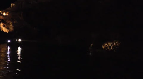 A Group of Spelunkers Explores a Cave with a Flashlight Stock Footage 51913903