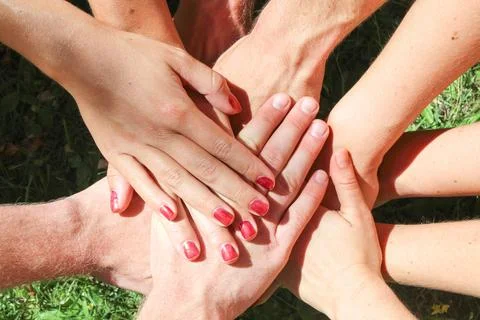 Group stacks hands Stock Photos