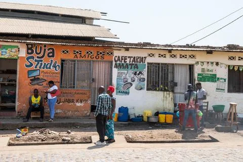 A group standing in front of a building that says buy a stand, Burundi Stock Photos