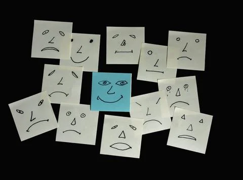 A Group of Sticky Notes is Placed on a Black Surface 스톡 사진