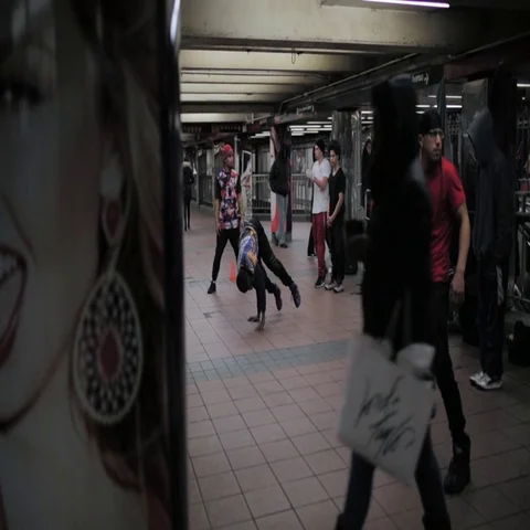 Group of street dancers practicing a dance move at underground station Stock Footage 69454843